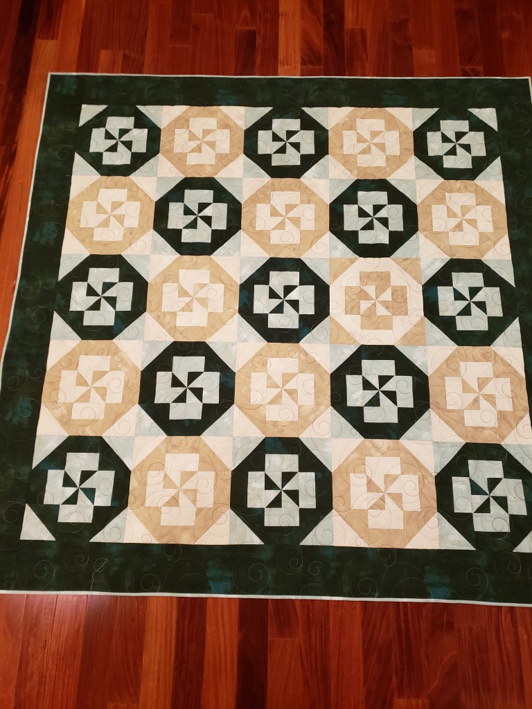 Kris: Graduation quilt called Life Interrupted (thus the one odd block) for my granddaughter.