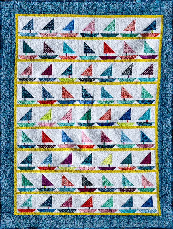 Barb P: The Third quilt is for my grandson and is also twin size.  I call it "Bay Regatta" since they live in the San Francisco Bay area  quilted by Char Koppenol of Allendale.