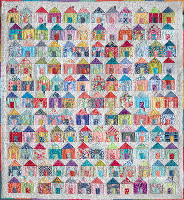 Barb P: This last quilt I finished in January and it was quilted by Char Koppenol.  I call it "It Takes a Village".