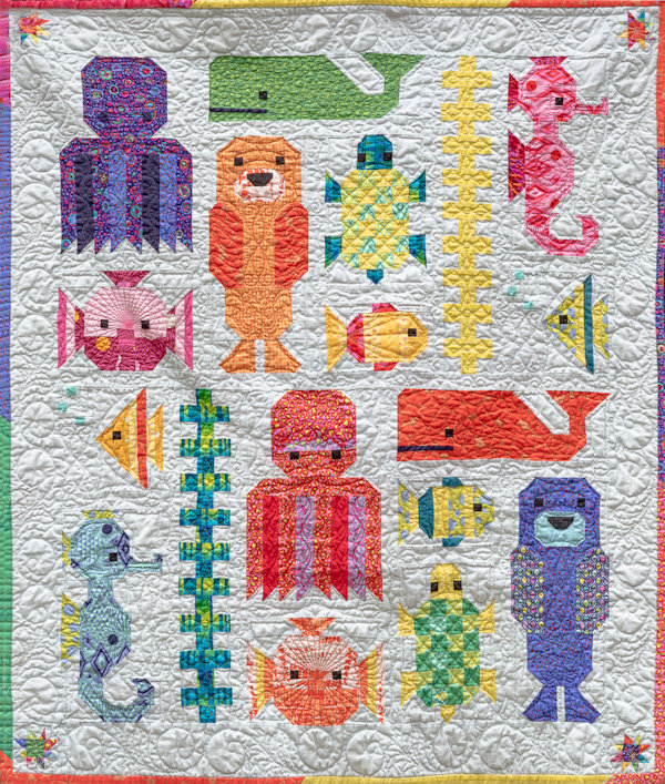 Barb P: The Fifth quilt is for the same grandchild that is due the end of September and is a crib quilt and inspired by the Monterey Bay Aquarium as they live near there in California.  I call it "Monterey Bay-B Quilt" Quilted by Darla Parks.